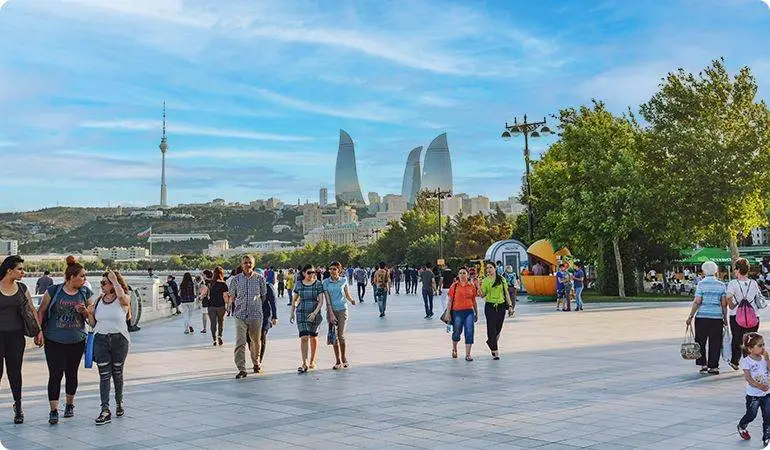 Locals and tourists walking safely along Baku Boulevard