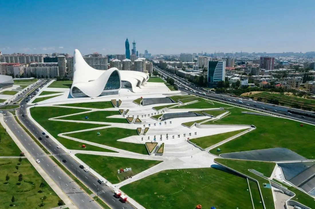 Taza Pir Mosque with reflecting pool and Flame Towers