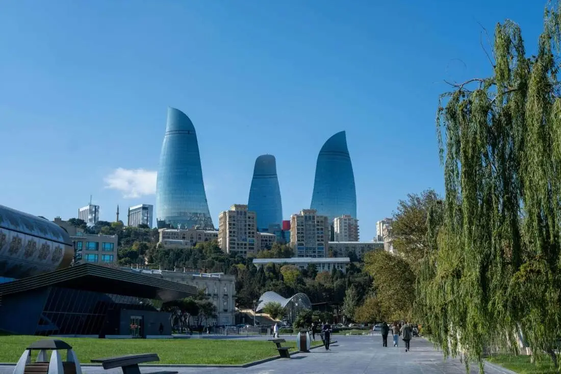 Baku waterfront promenade with Crystal Hall at dusk